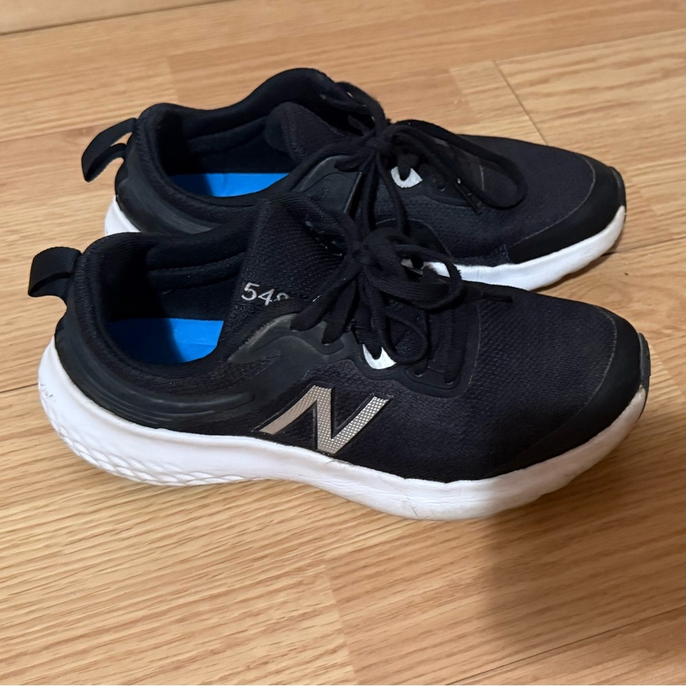 Women’s New Balance Kids Black and White Sneakers